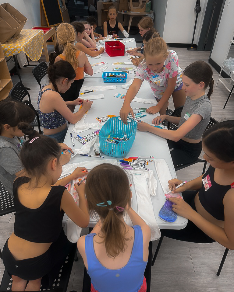 Students working on craft at summer camp in super kid play school